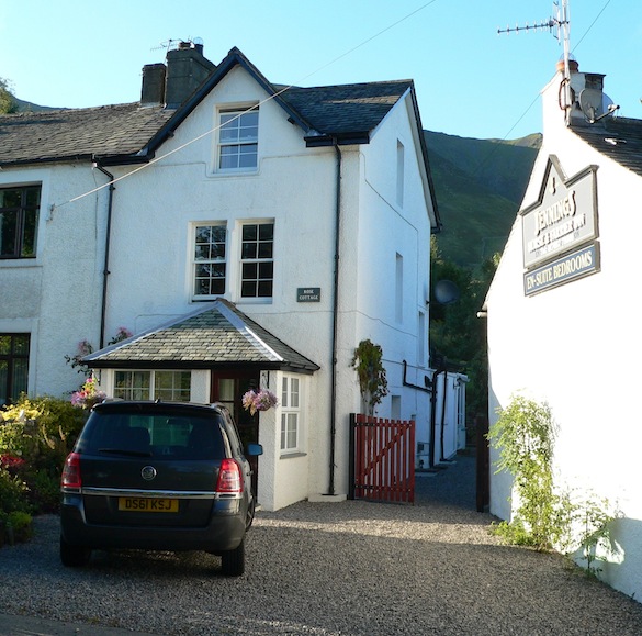 Front view of Rose
                  Cottage, with ample parking and close to pub